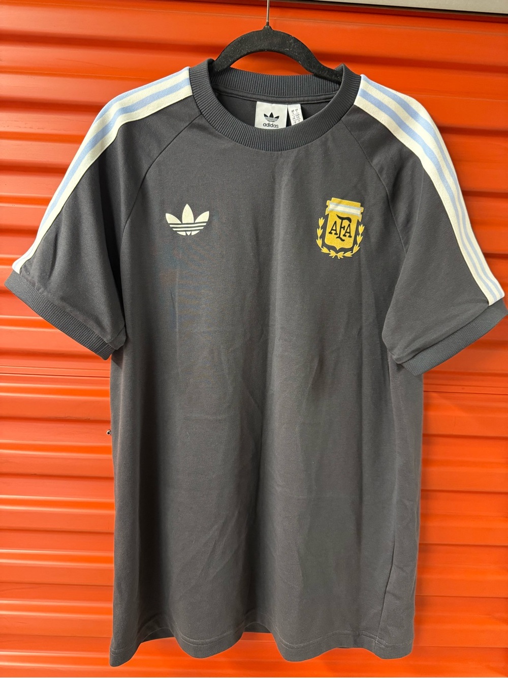 adidas Dark Gray Short Sleeve Tee with Light Blue Stripes and Yellow Crest